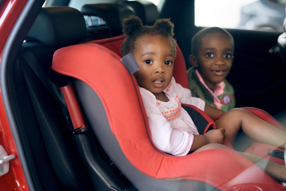 Buckle up. Cropped portrait of a young brother and sister sitting in a carseat.