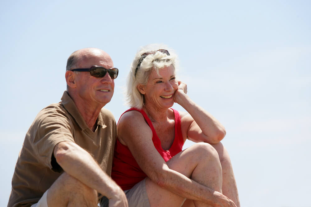 older couple enjoying retirement in a sunny location