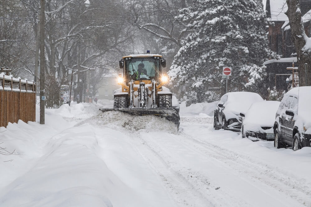 Toronto 2025-02-16 Snowplow clearing neighbourhood street during a snowstorm