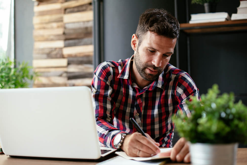 Man looking at computer checking credit score