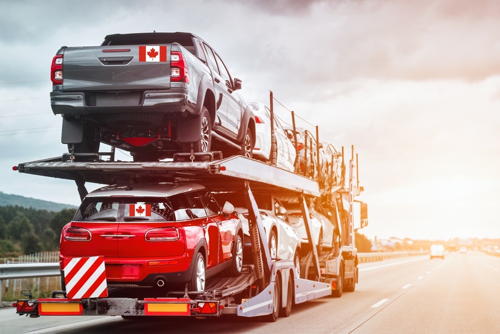 Flatbed_truck_carrying_Canadian_cars_on_highway