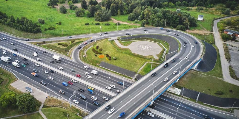 Aerial shot of on-ramp to major highway with lots of traffic