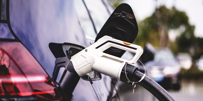 EV charger in purple car