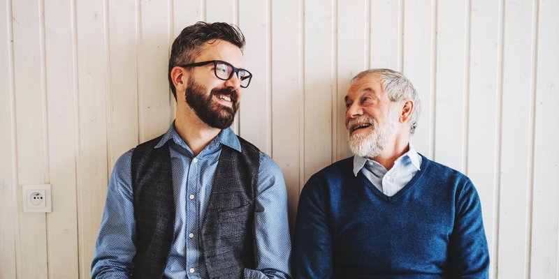 Grown man and father enjoying time together in candid portrait