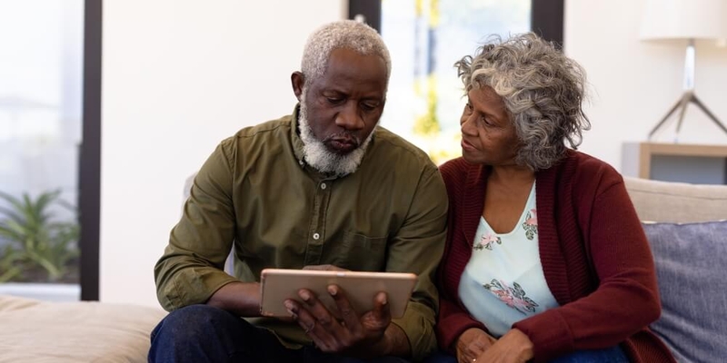 senior parents looking over important financial documents_should you cosign your childs mortgage.jpg