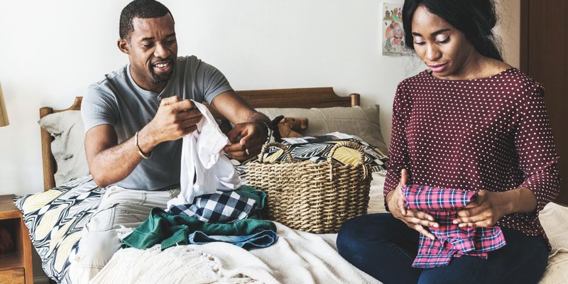 A couple folding the laundry together