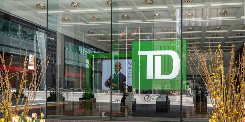 The view from outside a glass window at a TD bank branch