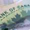 Closeup macro Bank of Canada words on a green 20 dollar Canadian money bill
