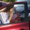 person on the phone with her insurer after being rear ended