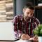 Man looking at computer checking credit score