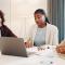 group of women entrepreneurs meeting doing taxes