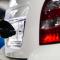 Mechanic fixing car licence plate number