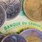 Canadian dollar coins on a Canadian bank note 