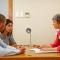 Financial consultant, documents and woman with couple in office for budget planning, advice and investment