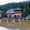 Flooded destroyed house following floods