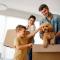New home. Parents with child moving in new house, property mortgage and real estate investment.
