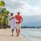 Couple in love hugging while walking on a sandy exotic beach. (1).jpg