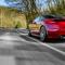 Generic red sports car driving fast on the open road (1).jpg