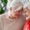Happy senior woman with her adult daughter at home.jpg