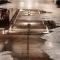Water covers the floor of a parking garage