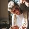 Two loving seniors cook together in the kitchen