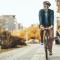 An older man rides his bike in the city