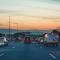 Several lanes of traffic on a highway during dusk