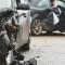 A serious car accident/collision with two vehicles, with person still inside