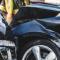 A close up view of damage to two black vehicles