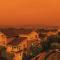 A town coated in thick orange smoke