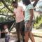 Young parents and their toddler son get ready to load into the car