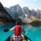 man canoeing in alberta visitors to canada insurance.jpg