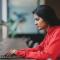 Woman working at a coworking space on her laptop