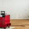 red dehumidifier in an empty apartment with a toxic mold and mildew problem.jpg