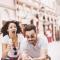 A couple almost loses their ice cream as they walk down the street
