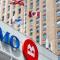 A BMO branch with Canadian flags waving in the wind