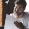 A man looks upset as he reviews a document