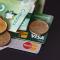 A pile of credit cards, Canadian banknotes and coins