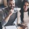A young couple meet with a representative to buy a home