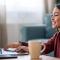 woman working from home with a smile on her face_do freelancers need freelance insurance.jpg